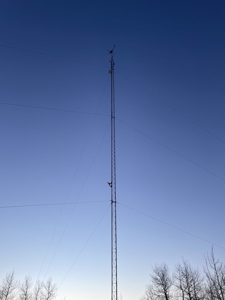Wireless tower against a blue sky